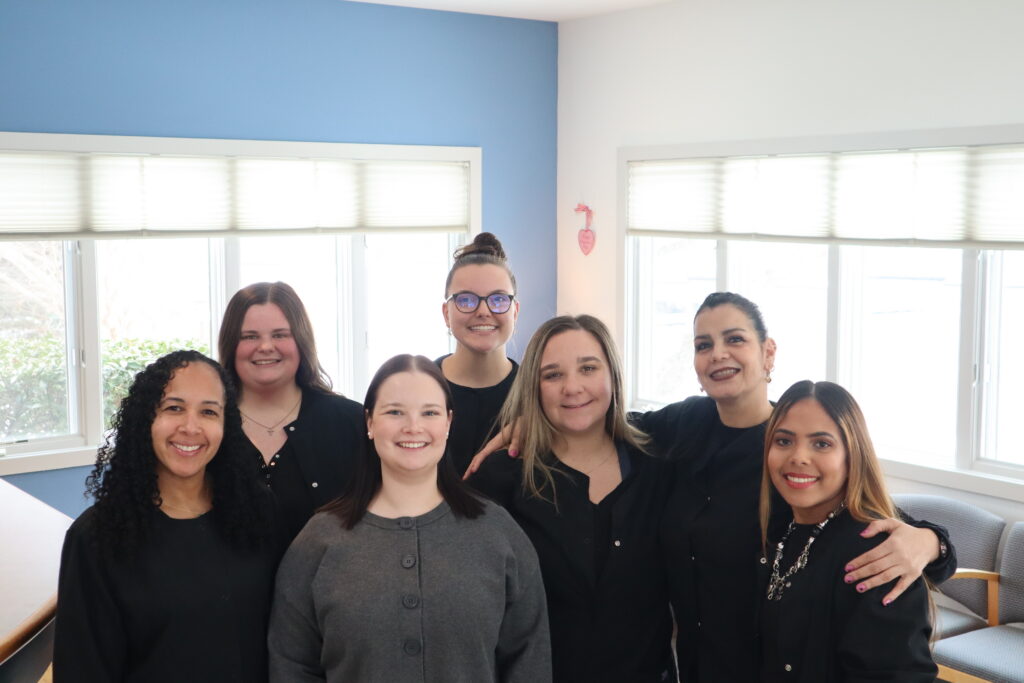 Staff of Mount Penn Orthodontics in black outfits.